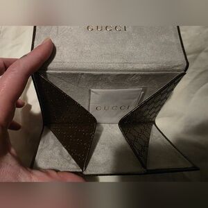 Gucci folding sunglasses hard case featuring the signature embossed GG monogram